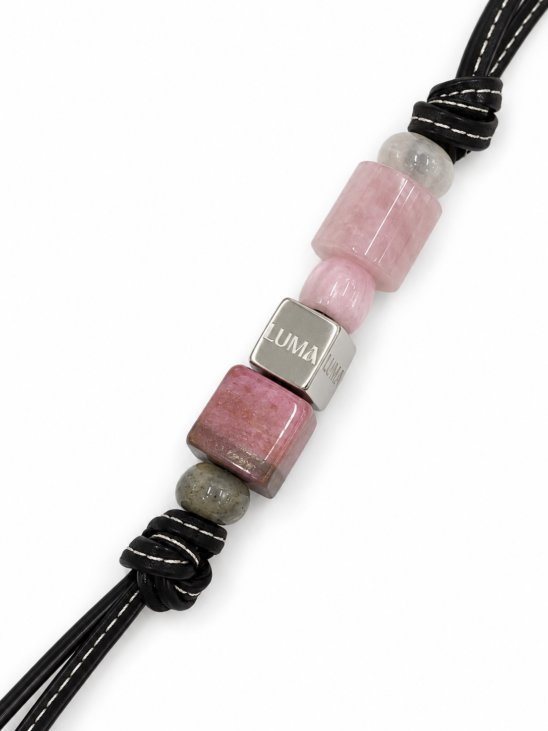 Petal leather bag charm close-up with pink stones and LUMA cube